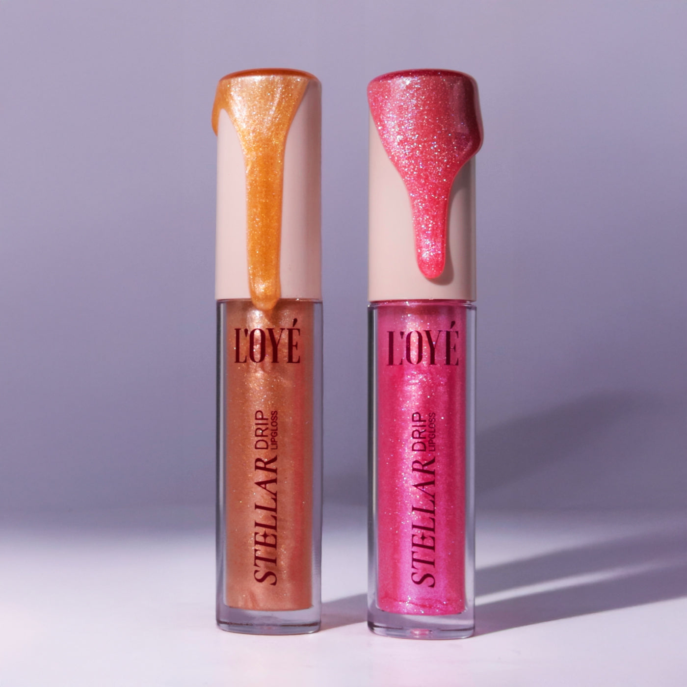 Zo draag je Stellar Drip Gloss over lipstick voor een glassy finish
